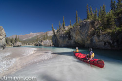 two canoers padding Snake River near milk Creek tributary, Yukon